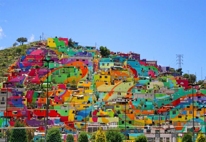 In the center of a small neighborhood located in the city of Pachuca, Hidalgo, is the largest graffiti mural in all of Mexico. The mural was painted onto a canvas of 200 homes on the hillside district of Las Palmitas.